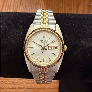 New Seiko womans silver and gold stainless steel watch